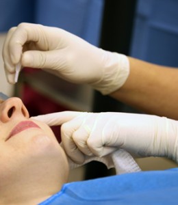 Laser eye surgery treatment: Anaesthetic and antiseptic eye drops are applied.